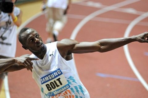 Usain Bolt of Jamaica reacts after winning the men's 100 metres event at the Herculis Diamond League athletics meeting at Louis II stadium in Monaco July 22, 2011. REUTERS/Christian Alminana (MONACO - Tags: SPORT ATHLETICS)