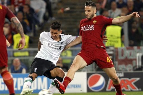 Liverpool's Roberto Firmino, left, is challenged by Roma's Kostas Manolas during the Champions League semifinal second leg soccer match between Roma and Liverpool at the Olympic Stadium in Rome, Wednesday, May 2, 2018. (AP Photo/Riccardo De Luca)