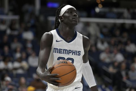 Memphis Grizzlies forward Wenyen Gabriel handles the ball in the first half of an NBA basketball game against the Charlotte Hornets Wednesday, March 13, 2024, in Memphis, Tenn. (AP Photo/Brandon Dill)