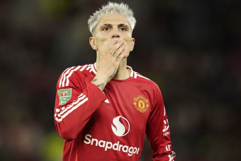 Manchester United's Alejandro Garnacho celebrates after scoring his side's fourth goal during the English League Cup soccer match between Manchester United and Barnsley at Old Trafford, Manchester, England, Tuesday, Sept. 17, 2024. (AP Photo/Dave Thompson)