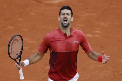 Serbia's Novak Djokovic celebrates winning his fourth round match of the French Open tennis tournament against Argentina's Francisco Cerundolo at the Roland Garros stadium in Paris, Monday, June 3, 2024. (AP Photo/Jean-Francois Badias)