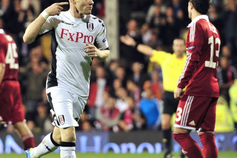 Fulham's English striker Andy Johnson (L) celebrates after scoring his team's second goal against Wisla Krakow during their UEFA Europa League, Group K, football match in London on November 3, 2011. AFP PHOTO / GLYN KIRK (Photo credit should read GLYN KIRK/AFP/Getty Images)