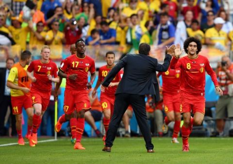 BELO HORIZONTE, BRAZIL - JUNE 17:  Marouane Fellaini of Belgium (R) celebrates scoring his team's first goal with head coach Marc Wilmots during the 2014 FIFA World Cup Brazil Group H match between Belgium and Algeria at Estadio Mineirao on June 17, 2014 in Belo Horizonte, Brazil.  (Photo by Ian Walton/Getty Images)