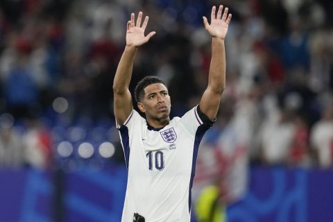 England's Jude Bellingham waves to the crowd after a win over Serbia in a Group C match between Serbia and England at the Euro 2024 soccer tournament in Gelsenkirchen, Germany, Monday, June 17, 2024. (AP Photo/Thanassis Stavrakis)