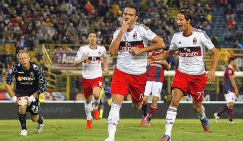 AC Milan's Giampaolo Pazzini (2nd R) celebrates after scoring against Bologna during their Italian Serie A soccer match at the Dall'Ara stadium in Bologna September 1, 2012. REUTERS/Alessandro Garofalo (ITALY - Tags: SPORT SOCCER)