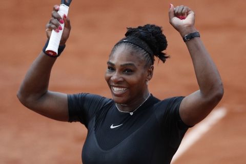 Serena Williams of the U.S. celebrates winning her third round match against Germany's Julia Georges of the French Open tennis tournament at the Roland Garros stadium in Paris, France, Saturday, June 2, 2018. (AP Photo/Christophe Ena )