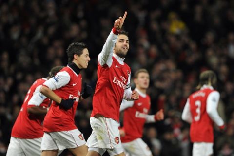 Arsenal's Spanish midfielder Cesc Fabregas (C) celebrates scoring the second goal with his team-mates during their English Premier League football match against Chelsea at the Emirates Stadium, London, on December 27, 2010. AFP PHOTO/CARL DE SOUZAFOR EDITORIAL USE ONLY Additional licence required for any commercial/promotional use or use on TV or internet (except identical online version of newspaper) of Premier League/Football League photos. Tel DataCo +44 207 2981656. Do not alter/modify photo. (Photo credit should read CARL DE SOUZA/AFP/Getty Images)