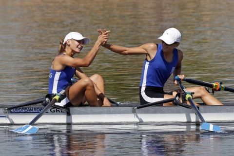 Christina Giazitzidou (L) and teammate Alexandra Tsiavou of Greece celebrate at the finish line after winning the women's lightweight double sculls final of the European Rowing Championship in Montemor o Velho September 12, 2010. REUTERS/Jose Manuel Ribeiro  (PORTUGAL - Tags: SPORT ROWING)