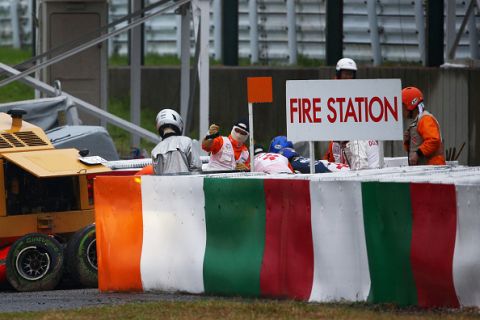 SUZUKA, JAPAN - OCTOBER 05:  Jules Bianchi of France and Marussia receives urgent medical treatment after crashing during the Japanese Formula One Grand Prix at Suzuka Circuit on October 5, 2014 in Suzuka, Japan.  (Photo by Clive Mason/Getty Images)