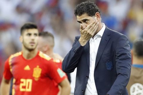 Spain head coach Fernando Hierro reacts after his team lost by penalty shootout during the round of 16 match between Spain and Russia at the 2018 soccer World Cup at the Luzhniki Stadium in Moscow, Russia, Sunday, July 1, 2018. (AP Photo/Antonio Calanni)