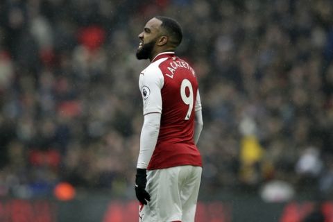 Arsenal's Alexandre Lacazette looks dejected after missing a chance to score during the English Premier League soccer match between Tottenham Hotspur and Arsenal at Wembley Stadium, London, Saturday, Feb. 10, 2018. (AP Photo/Tim Ireland)