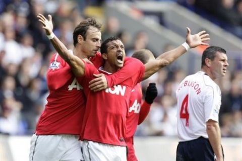 Manchester United's Nani, centre left, celebrates after scoring against Bolton during their English Premier League soccer match at The Reebok Stadium, Bolton, England, Sunday Sept. 26, 2010. (AP Photo/Jon Super)   **NO INTERNET/MOBILE USAGE WITHOUT FOOTBALL ASSOCIATION PREMIER LEAGUE(FAPL)LICENCE. EMAIL info@football-dataco.com FOR DETAILS. **