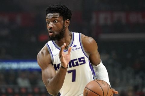 Sacramento Kings forward Chimezie Metu drives toward the basket during the first half of an NBA basketball game against the Los Angeles Clippers Wednesday, Dec. 1, 2021, in Los Angeles. (AP Photo/Mark J. Terrill)