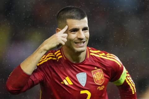 Spain's Alvaro Morata celebrates after scoring his side's second goal during the UEFA Nations League group 4 soccer match between Spain and Serbia at the Nuevo El Arcangel stadium in Cordoba, Spain, Tuesday, Oct. 15, 2024. (AP Photo/Jose Breton)