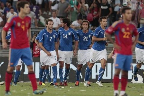 Italy's Alberto Aquilani, second from left, celebrates with teammates Giampaolo Pazzini, left, Andrea Pirlo, second from right, and Cristian Maggio after scoring during a friendly soccer match against Spain in Bari, Italy, Wednesday, Aug. 10, 2011. (AP Photo/Gregorio Borgia)