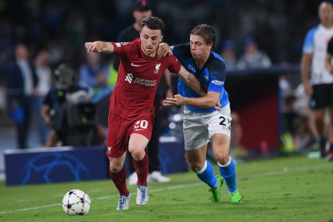 Diogo Jota of Liverpool FC and Alessio Zerbin of SSC Napoli compete for the ball during the UEFA Champions League match