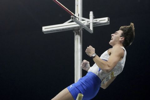 Sweden's Armand Duplantis celebrates as he crosses 6.03 meter during the men's pole vault competition as part of the 2022 Indor ISTAF track and field meeting in Berlin, Germany, Friday, Feb. 4, 2022. (AP Photo/Michael Sohn)