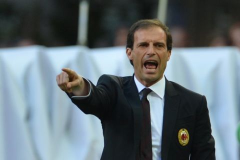 AC Milan's coach Massimiliano Allegri gestures during the Italian Serie A football match between AC Milan and Genoa on April 25, 2012 at San Siro Stadium in Milan. AFP PHOTO / GIUSEPPE CACACE (Photo credit should read GIUSEPPE CACACE/AFP/Getty Images)