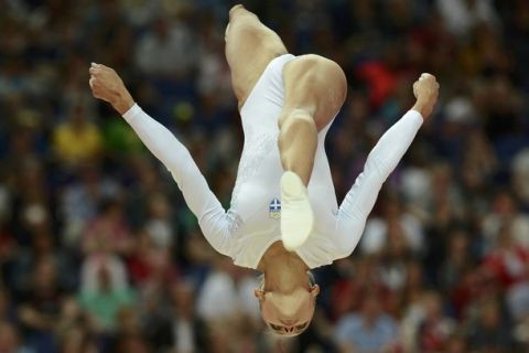 Vasiliki Millousi of Greece performs on the balance beam during the women's gymnastics qualification at the North Greenwich Arena during the London 2012 Olympic Games July 29, 2012.     REUTERS/Dylan Martinez (BRITAIN  - Tags: SPORT GYMNASTICS OLYMPICS)  