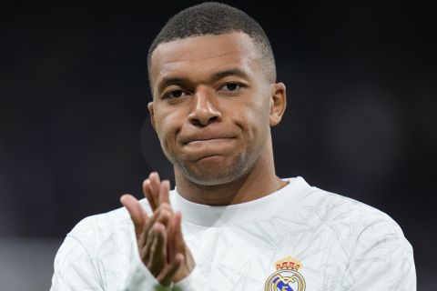 Real Madrid's Kylian Mbappe applauds before a Spanish La Liga soccer match between Real Madrid and Barcelona at the Santiago Bernabeu stadium in Madrid, Spain, Saturday, Oct. 26, 2024. (AP Photo/Manu Fernandez)