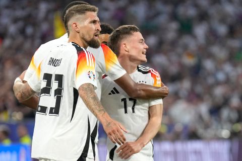 Germany's Florian Wirtz, center, celebrates after scoring the opening goal during a Group A match between Germany and Scotland at the Euro 2024 soccer tournament in Munich, Germany, Friday, June 14, 2024. (AP Photo/Ariel Schalit)