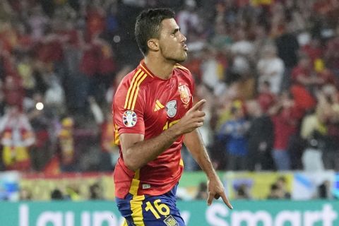 Spain's Rodri celebrates after scoring during a round of sixteen match between Spain and Georgia at the Euro 2024 soccer tournament in Cologne, Germany, Sunday, June 30, 2024. (AP Photo/Martin Meissner)