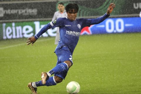 Gent's Gift Orban, left, in action during the Europa Conference League round of 16 first leg soccer match between Gent and Istanbul Basaksehir at KAA Gent stadium in Ghent, Belgium, Thursday, March 9, 2023. (AP Photo/Olivier Matthys)