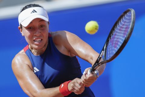 Jessica Pegula of the United States hits a backhand shot to Viktorija Golubic of Switzerland during the women's singles tennis competition, at the 2024 Summer Olympics, Sunday, July 28, 2024, in Paris, France. (AP Photo/Andy Wong)