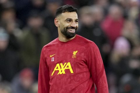 Liverpool's Mohamed Salah smiles during warmup before the Champions League opening phase soccer match between Liverpool and Real Madrid at Anfield Stadium, Liverpool, England, Wednesday, Nov. 27, 2024. (AP Photo/Jon Super)