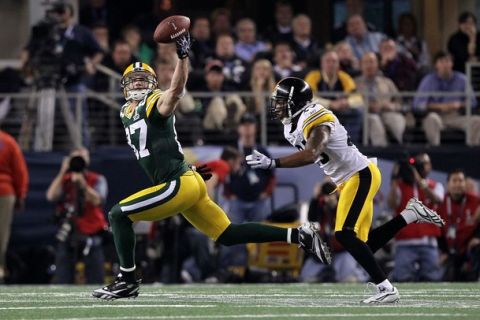 ARLINGTON, TX - FEBRUARY 06: Jordy Nelson #87 of the Green Bay Packers goes up for a pass against Ryan Clark #25 of the Pittsburgh Steelers during Super Bowl XLV at Cowboys Stadium on February 6, 2011 in Arlington, Texas.  (Photo by Al Bello/Getty Images)