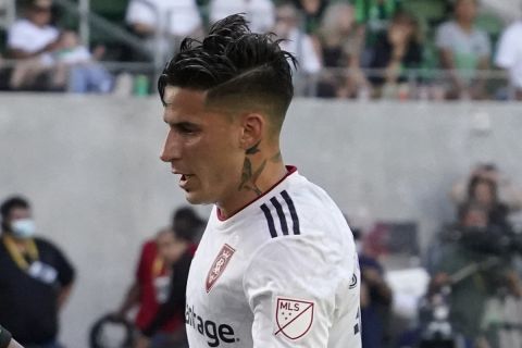 Austin FC forward Sebastián Driussi (25) shoots against Real Salt Lake forward Jonathan Menéndez (10) and defender Erik Holt during the second half of an MLS soccer match in Austin, Texas, Saturday, Oct. 2, 2021. (AP Photo/Chuck Burton)