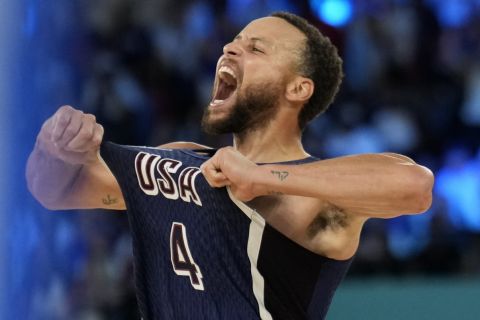 United States' Stephen Curry (4) celebrates after beating France to win the gold medal during a men's gold medal basketball game at Bercy Arena at the 2024 Summer Olympics, Saturday, Aug. 10, 2024, in Paris, France. (AP Photo/Mark J. Terrill)