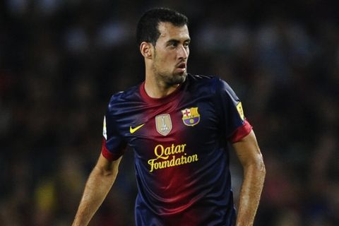 BARCELONA, SPAIN - AUGUST 23:  Sergio Busquets of FC Barcelona runs with the ball during the Super Cup first leg match between FC Barcelona and Real Madrid at Camp Nou on August 23, 2012 in Barcelona, Spain.  (Photo by David Ramos/Getty Images)