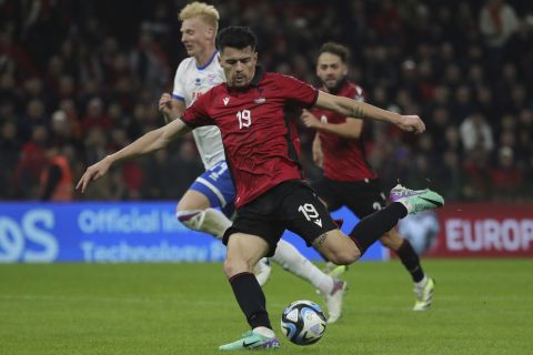 Albania's Mirlind Daku takes a shot during the Euro 2024 group E qualifying soccer match between Albania and Faroe Islands at Air Albania stadium in Tirana, Albania, Monday, Nov. 20, 2023. (AP Photo/Armando Babani)