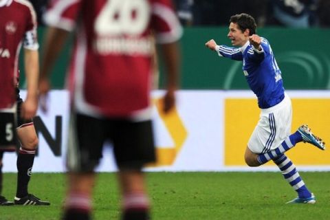 Schalke's midfielder Julian Draxler celebrates his goal during the German Cup quarter-final football match of FC Schalke 04 against 1. FC Nuremberg on January 25, 2011 in Gelsenkirchen, western Germany. Schalke won the match 3-2, after 17-year-old Draxler scored in the last minute of the extra time.      AFP PHOTO    PATRIK STOLLARZ (Photo credit should read PATRIK STOLLARZ/AFP/Getty Images)