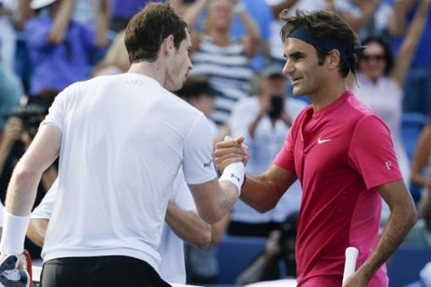 Roger Federer, of Switzerland, right, shakes hands with Andy Murray, of Great Britain, after winning their semifinal match at the Western & Southern Open tennis tournament, Saturday, Aug. 22, 2015, in Mason, Ohio. Federer won 4-6, 6-7 (6). (AP Photo/John Minchillo)