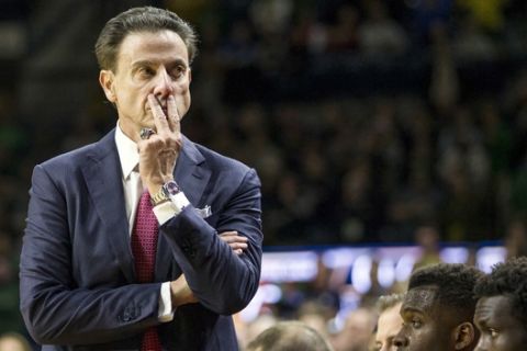 FILE - In this Jan. 4, 2017, file photo, Louisville head coach Rick Pitino looks on as his team falls behind late in the second half of an NCAA college basketball game against Notre Dame in South Bend, Ind.Louisville announced Wednesday, Sept. 27, 2017, that they have placed basketball coach Rick Pitino and athletic director Tom Jurich on administrative leave amid an FBI probe.  (AP Photo/Robert Franklin, File)