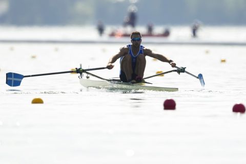 Stefanos Ntouskos, of Greece, competes in the men's single sculls rowing quarterfinal at the 2024 Summer Olympics, Tuesday, July 30, 2024, in Vaires-sur-Marne, France. (AP Photo/Lindsey Wasson)