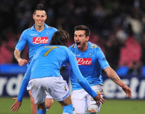 Napoli's Argentine forward Ezequiel Ivan Lavezzi celebrates vwith Urugayan Cavani and Napoli's Slovak midfielder Marek Hamsik (back) after scoring during the Champions League round of 16 first leg football match, Napoli vs Chelsea at San Paolo stadium in Naples on February 21, 2012.   AFP PHOTO / ALBERTO PIZZOLI (Photo credit should read ALBERTO PIZZOLI/AFP/Getty Images)