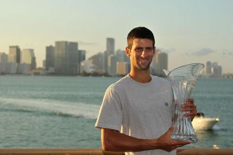 KEY BISCAYNE, FL - APRIL 03:  Novak Djokovic of Serbia poses with the trophy at the Rusty Pelican Restraunt after winning the men's singles title from the Sony Ericsson Open at Crandon Park Tennis Center on April 3, 2011 in Key Biscayne, Florida.  (Photo by Mike Ehrmann/Getty Images)