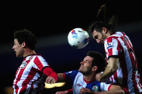 BLACKBURN, ENGLAND - MARCH 20:  Scott Dann of Blackburn Rovers battles with Sotirios Kyrgiakos of Sunderland during the Barclays Premier League match between Blackburn Rovers and Sunderland at Ewood park on March 20, 2012 in Blackburn, England.  (Photo by Laurence Griffiths/Getty Images)