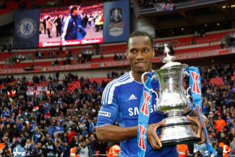 Chelsea's Ivorian striker Didier Drogba celebrates with the cup after Chelsea's 2-1 win in the FA Cup final football match between Liverpool and Chelsea at Wembley Stadium in London, England on May 5, 2012. AFP PHOTO/IAN KINGTON
                                                                                                             
NOT FOR MARKETING OR ADVERTISING USE / RESTRICTED TO EDITORIAL USEIAN KINGTON/AFP/GettyImages