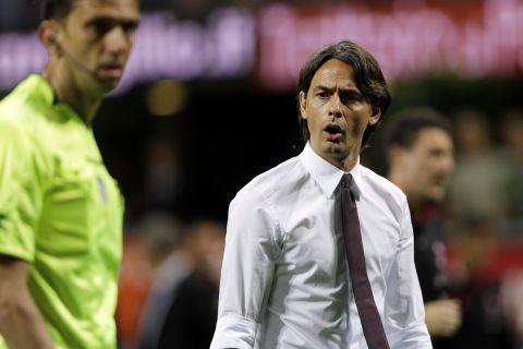 AC Milan coach Filippo Inzaghi argues with referee Paolo Tagliavento at the end of the first half time during a Serie A soccer match between AC Milan and Roma, at the San Siro stadium in Milan, Italy, Saturday, May 9, 2015. (AP Photo/Luca Bruno)