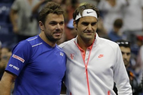 Stan Wawrinka, of Switzerland, left, and Roger Federer, of Switzerland, pose for a photo before playing a semifinal match at the U.S. Open tennis tournament, Friday, Sept. 11, 2015, in New York. (AP Photo/David Goldman)