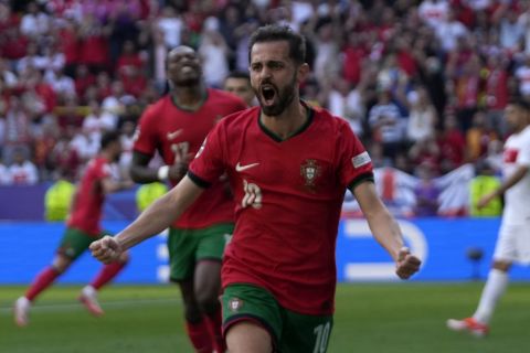 Portugal's Bernardo Silva celebrates after scoring the opening goal of his team, during a Group F match between Turkey and Portugal at the Euro 2024 soccer tournament in Dortmund, Germany, Saturday, June 22, 2024. (AP Photo/Themba Hadebe)