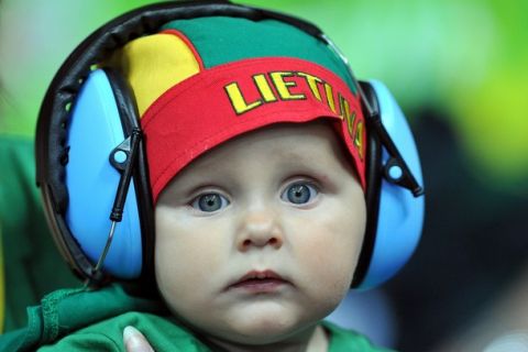 A young Lithuanian watchs the second round group A qualification match between Lithuania and Poland during the EuroBasket2011 in Panevezys on September 1, 2011. AFP PHOTO/JOE KLAMAR (Photo credit should read JOE KLAMAR/AFP/Getty Images)