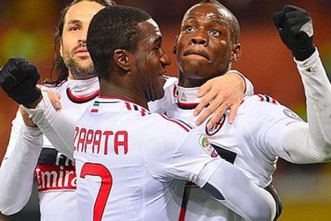 AC Milan's forward Mario Balotelli (R) celebrates after scoring a goal with AC Milan's Colombian defender Cristian Zapata (C) and AC Milan's Colombian defender Mario Yepes during the Italian championships Serie A football match Genoa vs AC Milan at the Marazzi Stadium in Genoa on March 8, 2013. AFP PHOTO / GIUSEPPE CACACE
