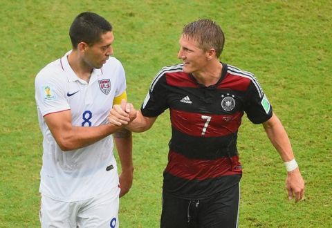 RECIFE, BRAZIL - JUNE 26: Clint Dempsey of the United States and Bastian Schweinsteiger of Germany shake hands during the 2014 FIFA World Cup Brazil group G match between the United States and Germany at Arena Pernambuco on June 26, 2014 in Recife, Brazil.  (Photo by Laurence Griffiths/Getty Images)