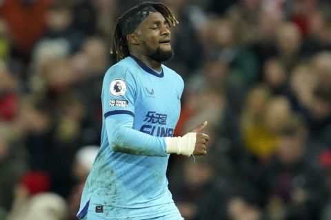 Newcastle's Allan Saint-Maximin leaves the field during the English Premier League soccer match between Liverpool and Newcastle United at Anfield stadium in Liverpool, England, Thursday, Dec. 16, 2021. (AP Photo/Jon Super)