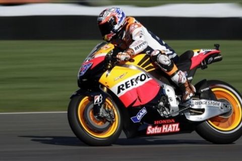 Casey Stoner, of Australia, rides his Honda during the final warm-up session before the running of the Indianapolis MotoGP motorcycle race at the Indianapolis Motor Speedway in Indianapolis, Sunday, Aug. 28, 2011. (AP Photo/AJ Mast)